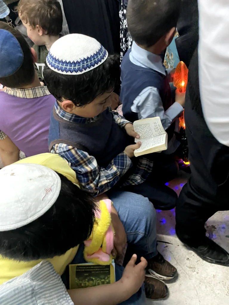 Boy reading Tehillim